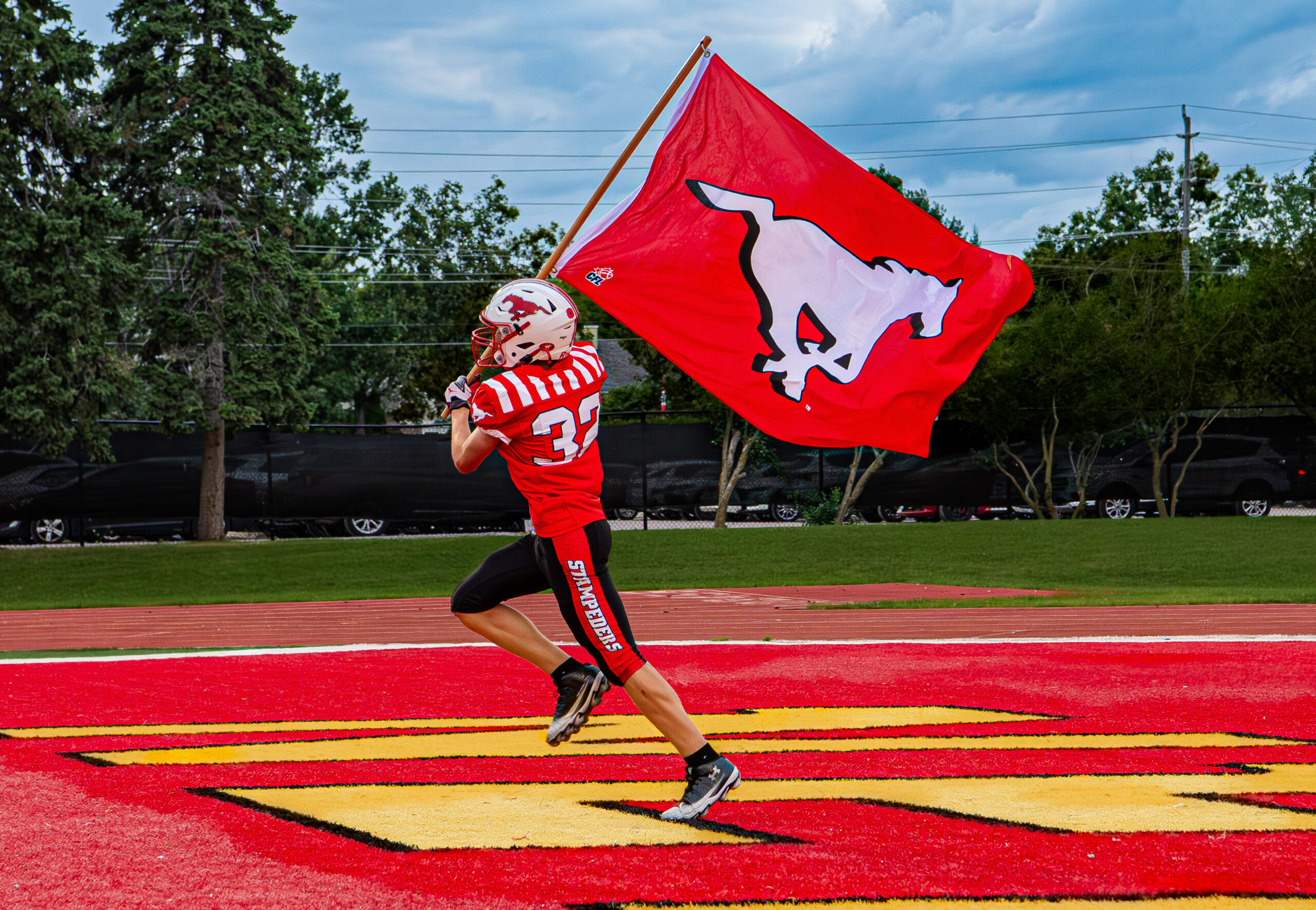 BMFA tackle football action during a game.